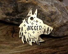 Load image into Gallery viewer, Wolf head dog tag, handstamped with howling wolf, trees and moon