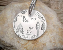 Load image into Gallery viewer, Large dog tag, hand stamped with trees, deer & eagle