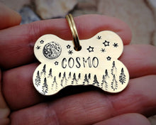 Load image into Gallery viewer, Bone dog tag, hand stamped with moon, stars & trees