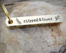Load image into Gallery viewer, Bar tag, dog id tag, hand stamped with leaf design and 'chipped & loved'