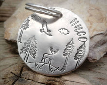 Load image into Gallery viewer, Large dog tag, hand stamped with trees, deer & eagle