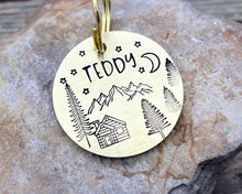Load image into Gallery viewer, Dog id tag, hand stamped with mountains, trees & cabin