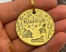 Load image into Gallery viewer, Christmas dog tag, hand stamped with Santa cabin and reindeer
