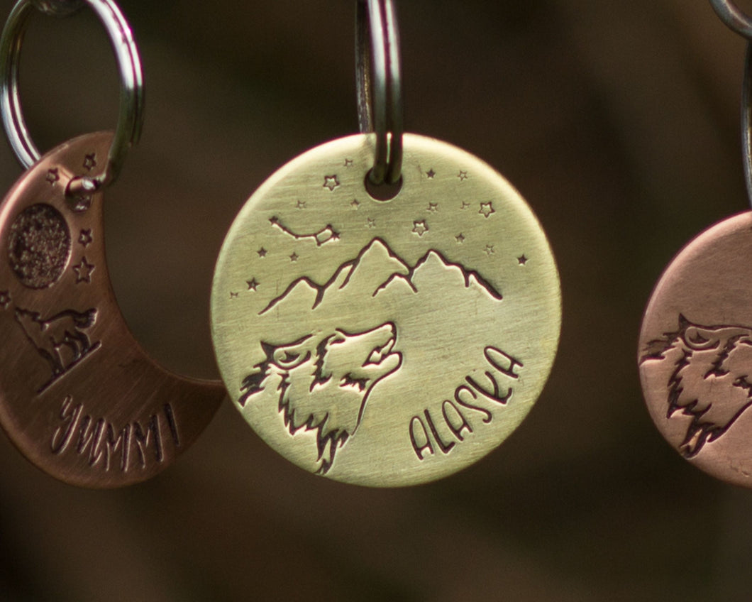 Dog id tag, hand stamped with wolf head, mountains & star design