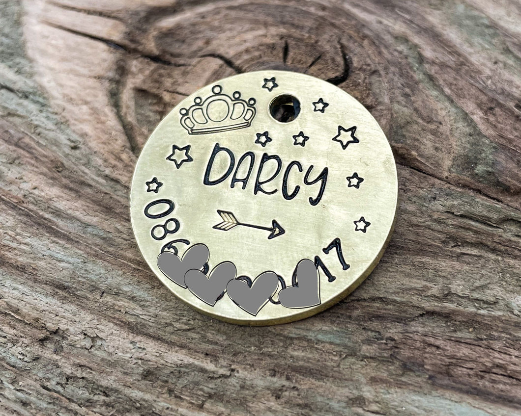 Microchipped dog tag, hand stamped with crown and phone number