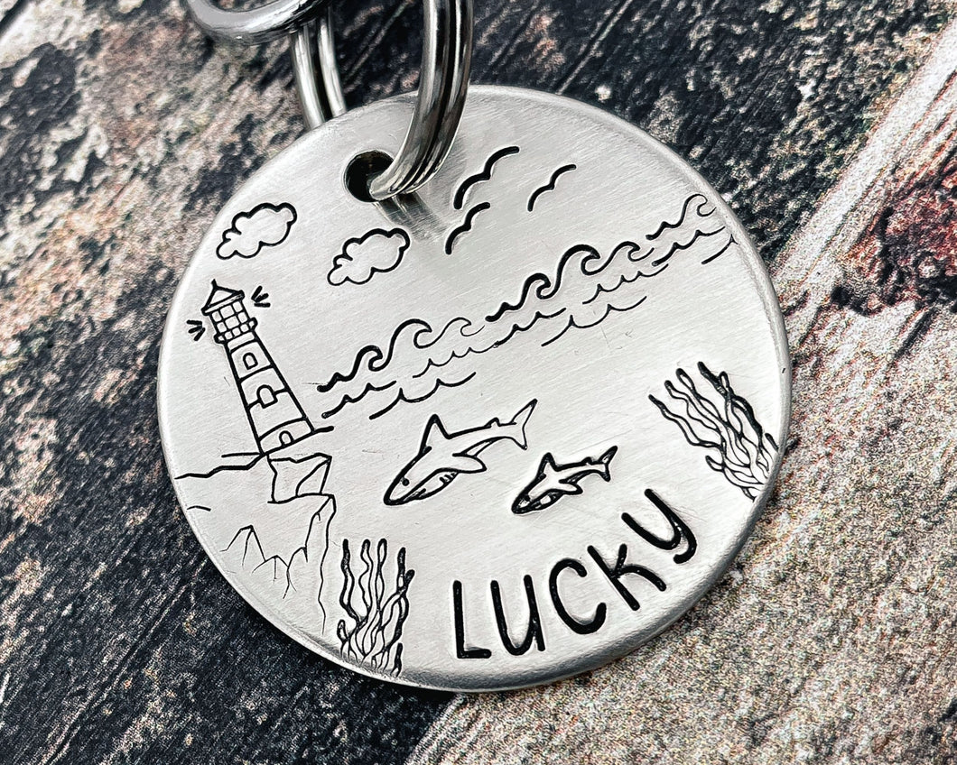 Ocean dog tag, hand stamped with sharks and lighthouse
