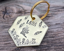 Load image into Gallery viewer, Hexagon dog tag, hand stamped with fairy design, flowers and feathers
