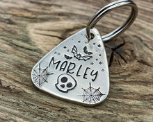 Load image into Gallery viewer, Spooky guitar pick dog id tag, hand stamped with bats, skull and cobwebs
