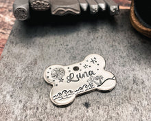 Load image into Gallery viewer, Bone dog id tag with moon and stars, handstamped pet id tag with up to 2 phone numbers or microchipped
