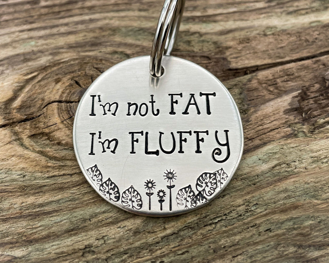 Funny dog tag, hand stamped with 'I'm not fat..I'm fluffy'
