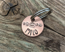Load image into Gallery viewer, Halloween cat name tag, hand stamped spooky pumpkin and leaves
