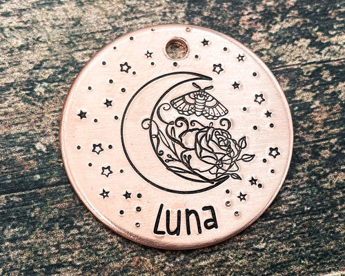 moon dog tag with flower and moth design
