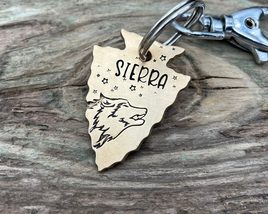 Arrow head dog id tag with wolfhead design