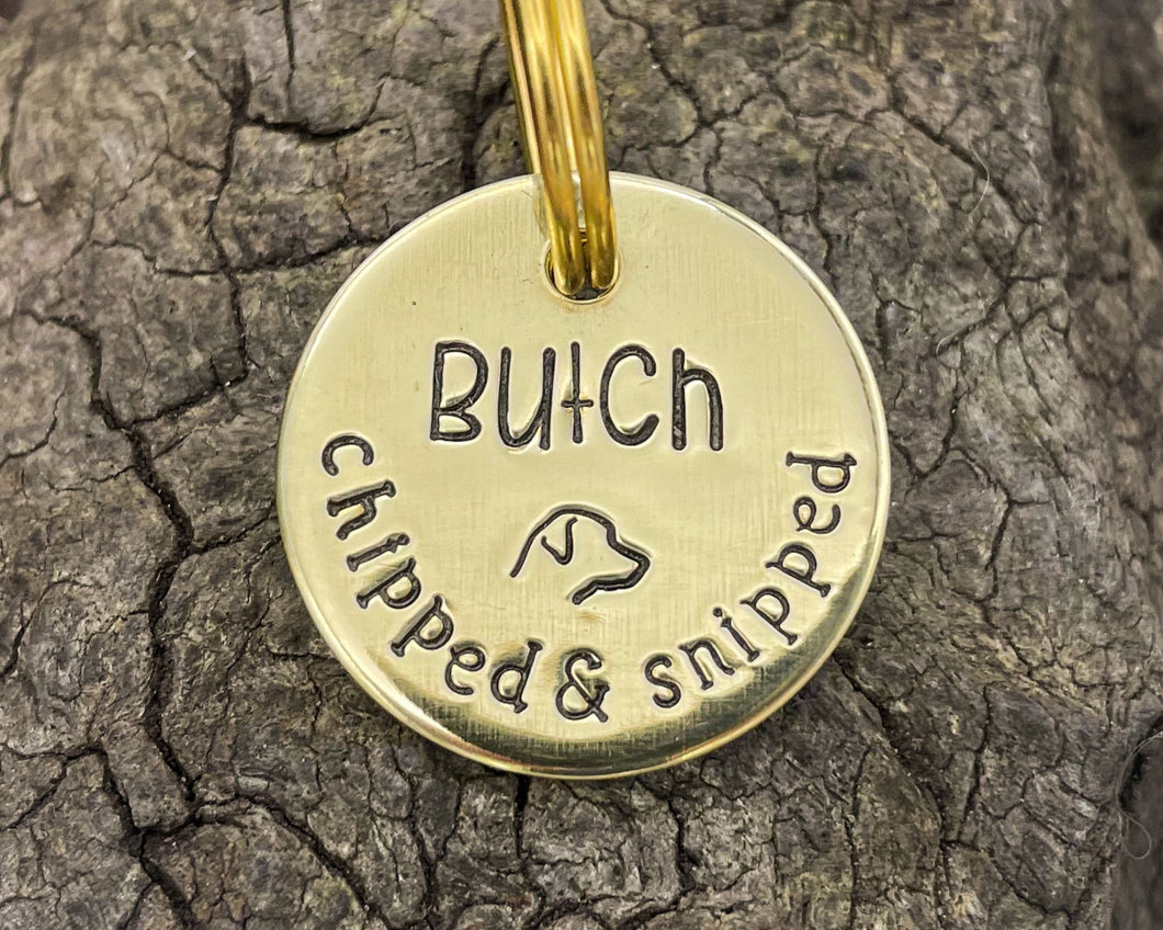 Microchipped dog tag, hand stamped with 'chipped & snipped'
