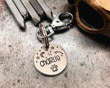 Load image into Gallery viewer, hand stamped dog tag with pawprint
