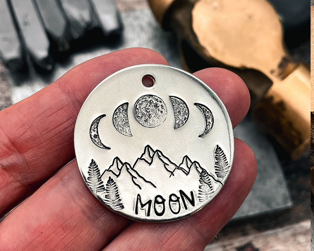 mountain dog tag with moon phase design