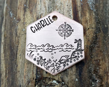 Load image into Gallery viewer, Hexagon dog tag, hand stamped with nautical design, compass &amp; lighthouse
