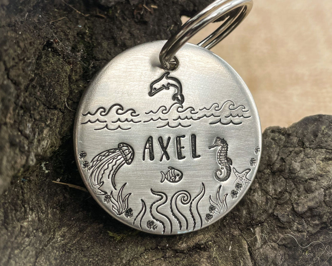 Ocean dog tag, hand stamped with seahorse, dolphin and waves