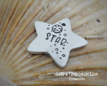 Load image into Gallery viewer, Small pet id tag, Aluminium star hand stamped with moon &amp; stars, lightweight cat tag
