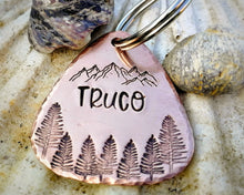 Load image into Gallery viewer, Guitar pick dog tag, hand stamped with mountains &amp; trees

