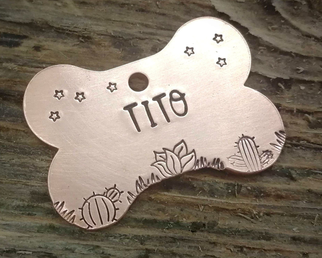 Bone dog tag, hand stamped with cactus design