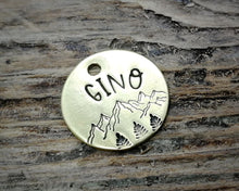 Load image into Gallery viewer, Cat id tag, hand stamped with mountains &amp; trees
