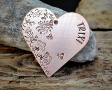 Load image into Gallery viewer, Large heart dog id tag, hand stamped with flower design &amp; bees
