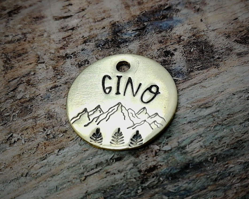 Cat id tag, hand stamped with mountains & trees