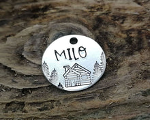 Load image into Gallery viewer, Cat name tag, hand stamped with trees &amp; cabin
