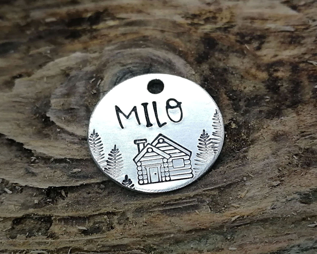 Cat name tag, hand stamped with trees & cabin