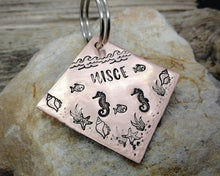 Load image into Gallery viewer, Square dog id tag, hand stamped with ocean design, seahorse &amp; fish

