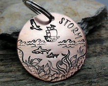 Load image into Gallery viewer, Large dog id tag, hand stamped with nautical design, ship &amp; sharks
