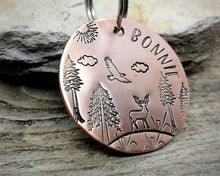 Load image into Gallery viewer, Large dog tag, hand stamped with trees, deer &amp; eagle
