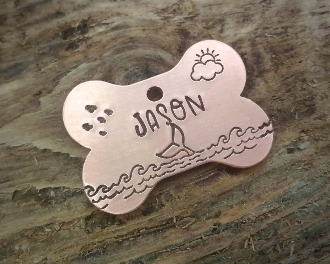 Bone dog tag, hand stamped with ocean design