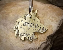Load image into Gallery viewer, Wolf head dog tag, handstamped with howling wolf, trees and moon
