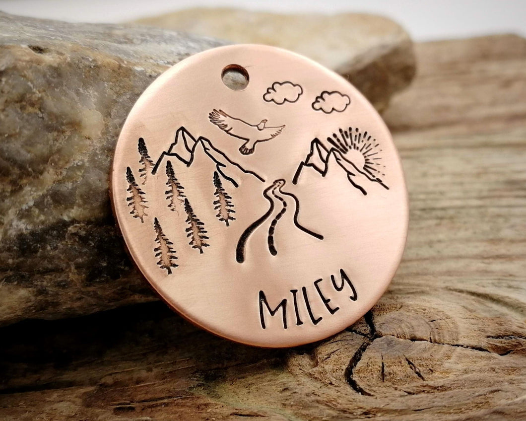 Dog tag, hand stamped with mountains, trees & eagle