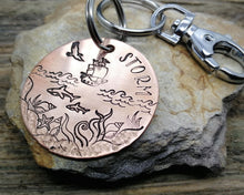 Load image into Gallery viewer, Dog tag with a matching keychain, hand stamped with ocean design
