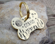 Load image into Gallery viewer, Bone dog tag, hand stamped with moon, stars &amp; trees
