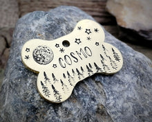 Load image into Gallery viewer, Bone dog tag, hand stamped with moon, stars &amp; trees
