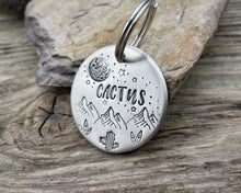 Load image into Gallery viewer, Dog id tag, hand stamped with mountains, cactus &amp; moon
