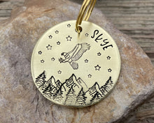 Load image into Gallery viewer, Large dog id, hand stamped with adventure design, mountains &amp; eagle
